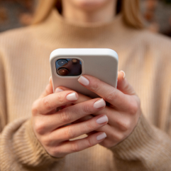 Image of woman holding phone