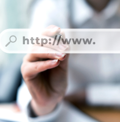 Image of woman touching a screen with a url on it