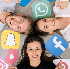 Image of smiling friends representing social media with the icons of snapchat, facebook and WhatsApp